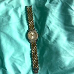 Anne Klein gold and silver tone watch. Crystal surround. Pearl and date face